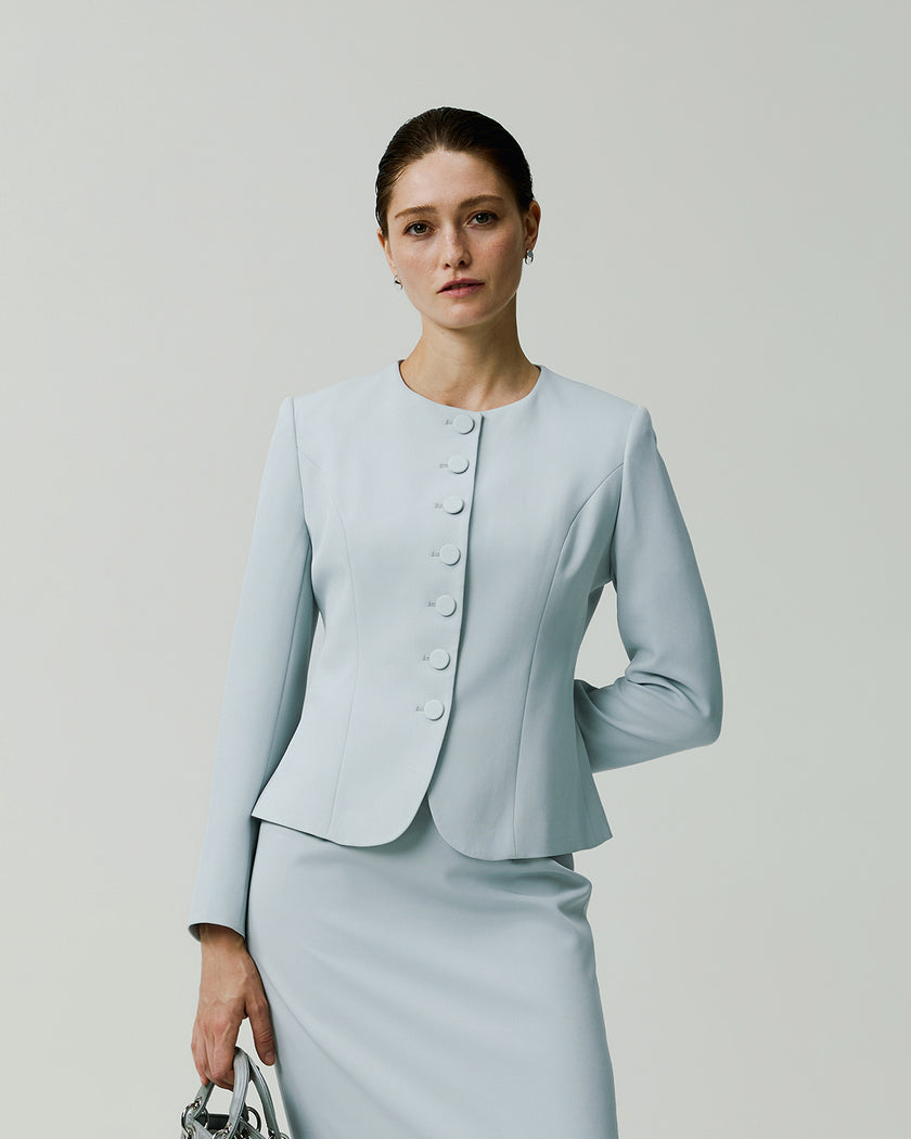 Piana Jacket in Powder Blue, front view showing the collarless round neckline and fitted waist